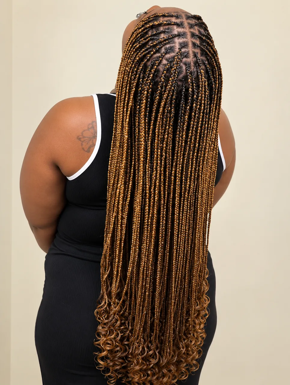 Extra-long knotless box braids in honey blonde and dark brown